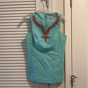Light blue/teal with pink jewel accented top